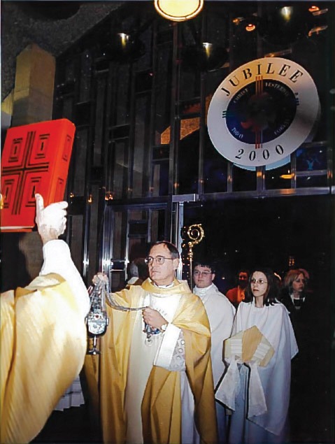 Image of Bishop Tobin walking through the cathedral doors for the jubilee