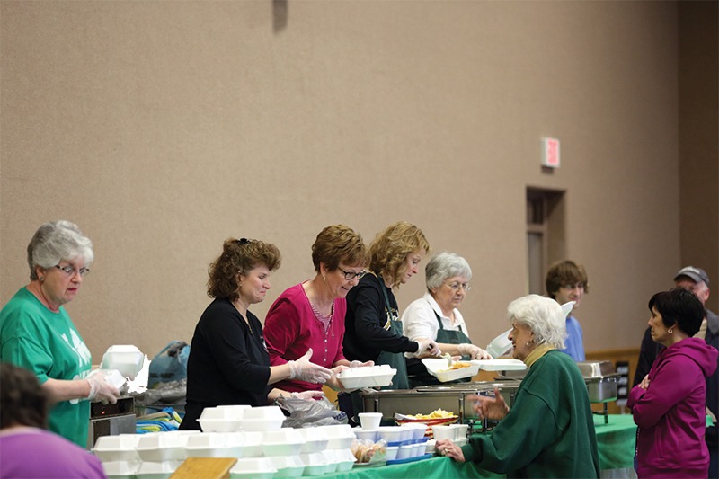 Women serving meals at their parish fish fry