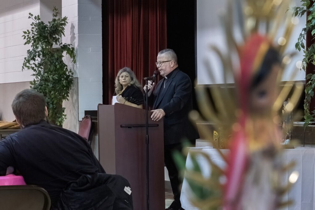 Bishop speaks at a podium during the Hispanic Conference 2025. Photo by Bob Rossiter