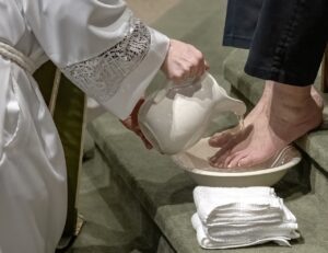Father washes feet during Holy Thursday Mass