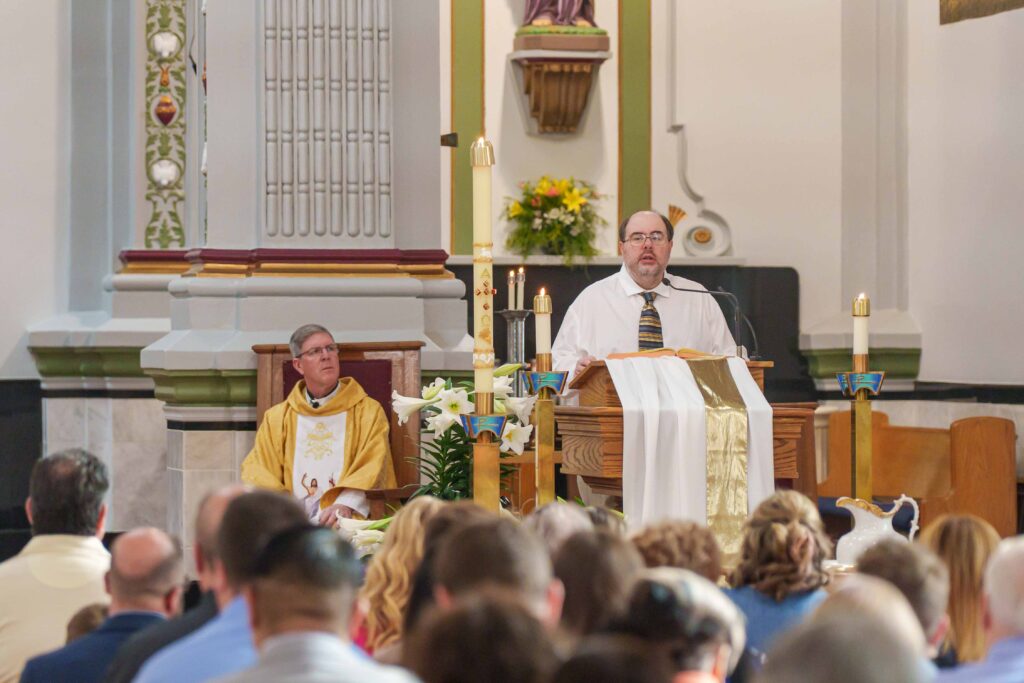 Lector performs the readings at Holy Trinity Parish in East Liverpool.