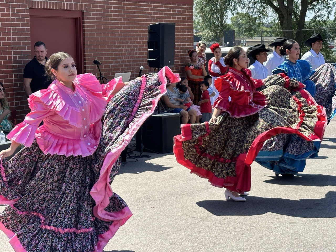 Image of hispanic women dancing in traditional garb
