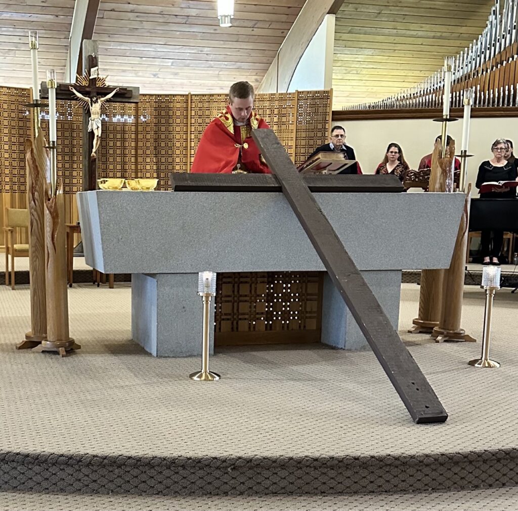 Cross leaned up against an altar at Our Lady of Peace Parish in Ashtabula during Good Friday. Photo by Marilou McClimans.
