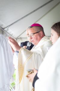 Bishop Bonnar blesses statue at basilica in Youngstown. Photo by Courtney Poullas