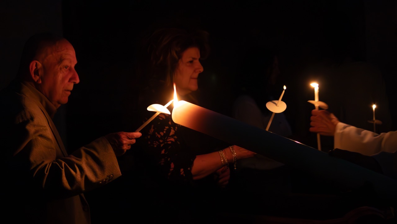 Parishioners light their candles at St. Patrick's in Youngstown. Photo by Courtney Poullas.
