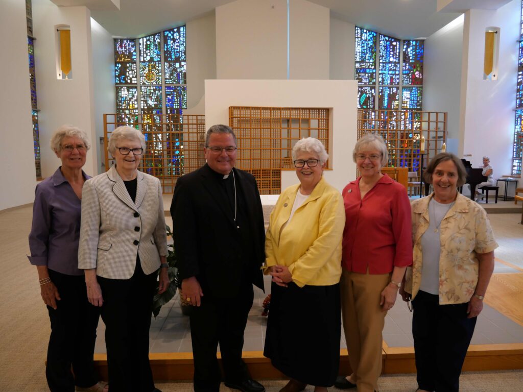 Bishop Bonnar poses with the Ursuline Sisters during the tour of the motherhouse 2025. Photo by Michael Houy