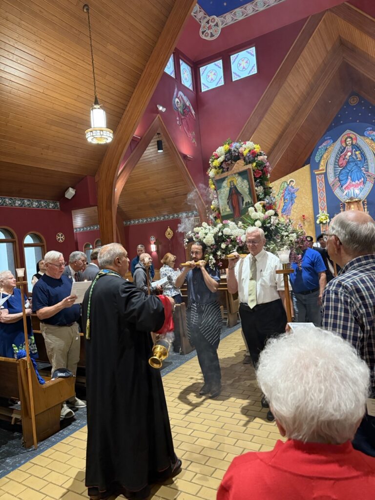 Parishioners carry the statue of the Blessed Mother at the Assumtion Pilgrimage in North Jackson
