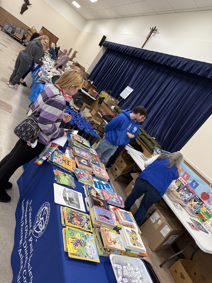 visitors peruse vendor tables at the community day of hope