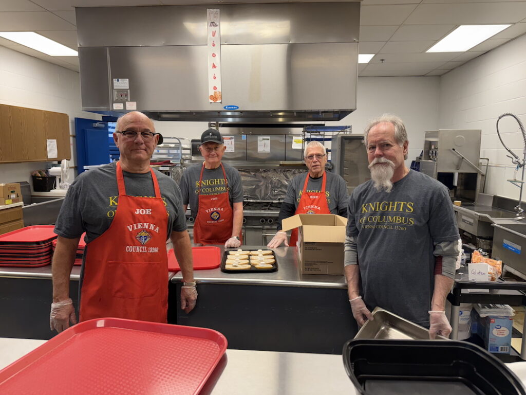 Knights of Columbus serve food at the community day of hope
