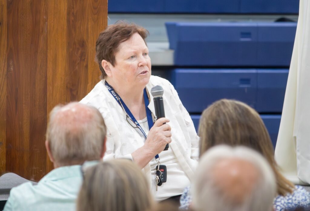 Sister Maureen Burke addresses the crowd at the Saint John Ribbon Cutting