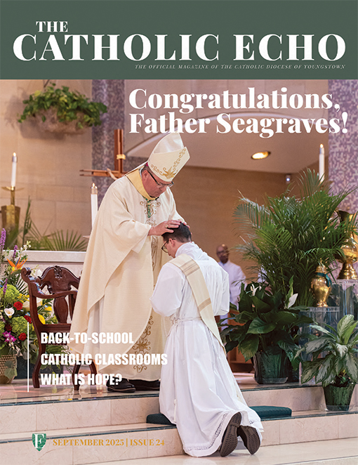 September issue cover of Father Seagraves receiving blessing from Bishop Bonnar.