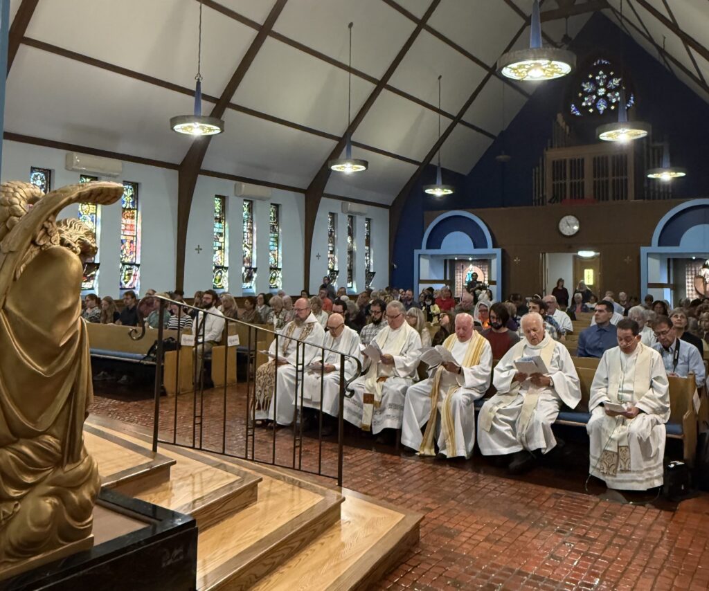 Priests and lay people gather at the chapel of the Poor Clares