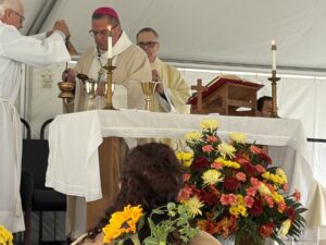 Bishop Bonnar fills censor at all souls cemetery mass