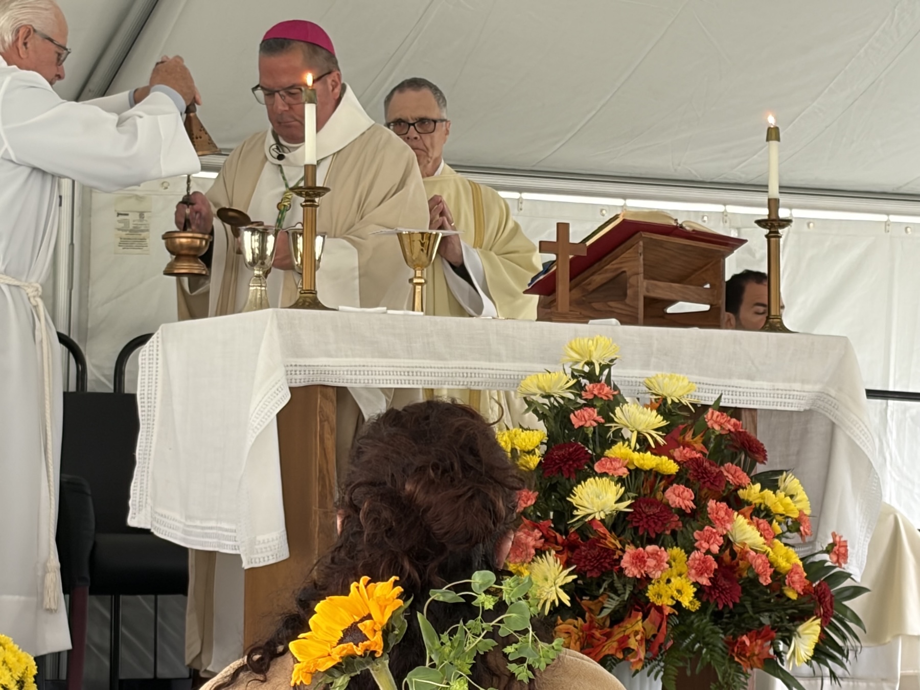 Bishop Bonnar fills censor at all souls cemetery mass