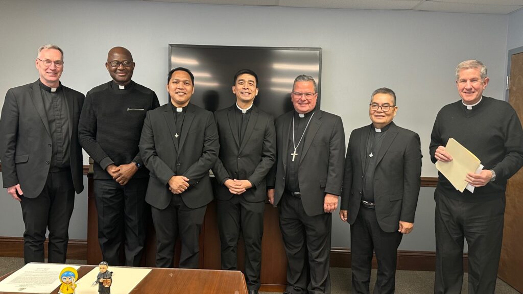 Bishop Bonnar poses with a group of Rogationists and Youngstown Diocese priests
