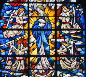 Stained Glass in the Church of Tervuren, Belgium, depicting Mother Mary and the Dogma of the Immaculate Conception.