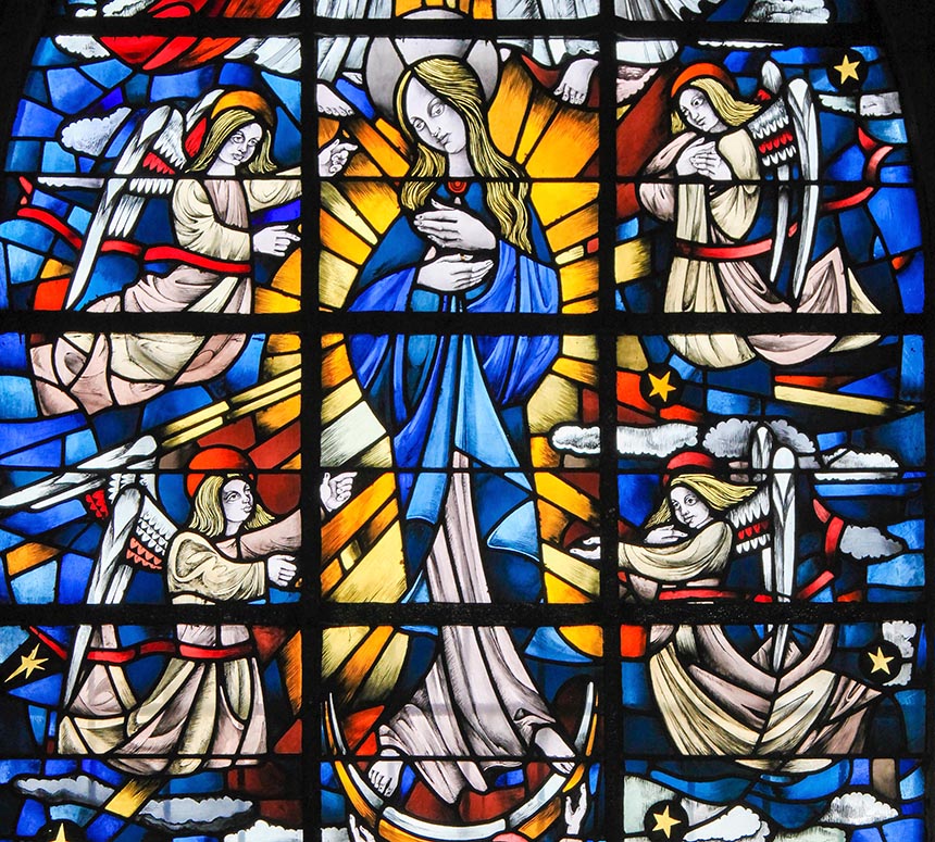 Stained Glass in the Church of Tervuren, Belgium, depicting Mother Mary and the Dogma of the Immaculate Conception.