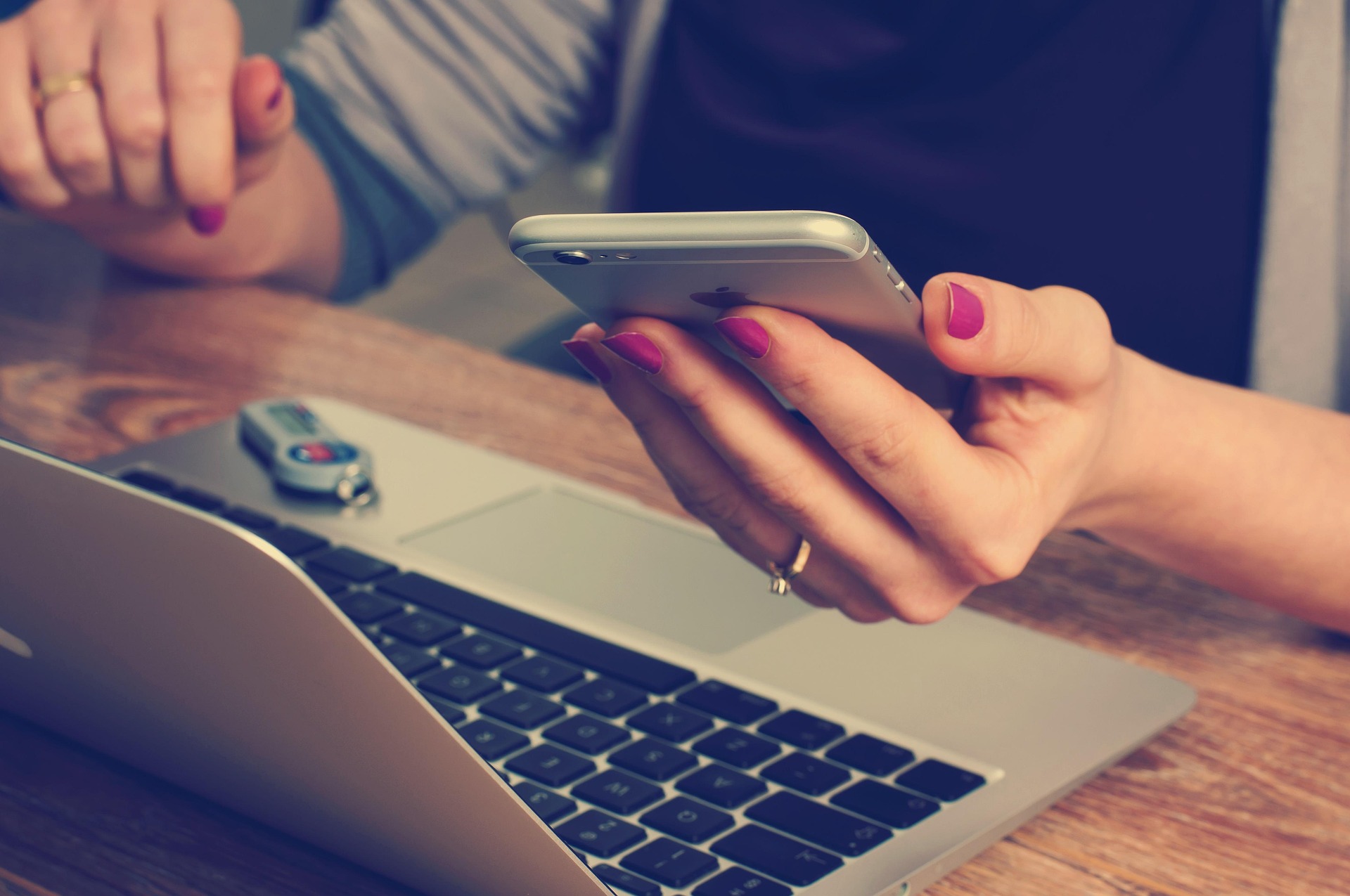 Woman using social media on her phone.