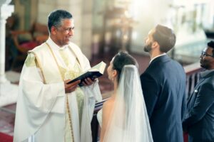 A couple getting married in a Catholic wedding